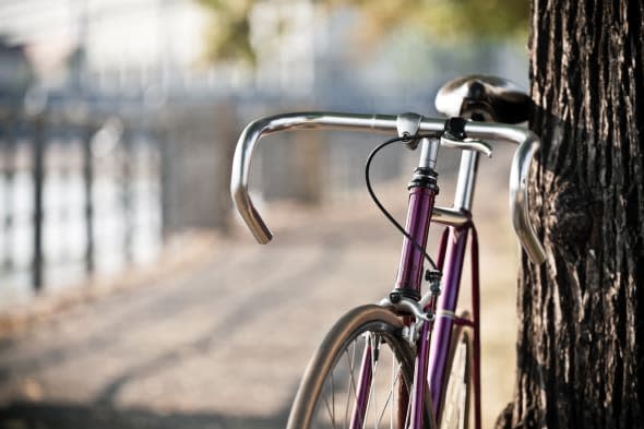 Road bicycle on city street, cycling in summer nature