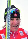 Canadian Devon Kershaw celebrates on the podium after winning the1,3 km Sprint Men men's event of the FIS World Cup Tour De Ski on January 5, 2011 in Toblach-Dobbiaco. Kershaw won the event ahead of Switzerland's Dario Cologna and Norway's Petter Northug. AFP PHOTO / ALBERTO PIZZOLI (Photo credit should read ALBERTO PIZZOLI/AFP/Getty Images)