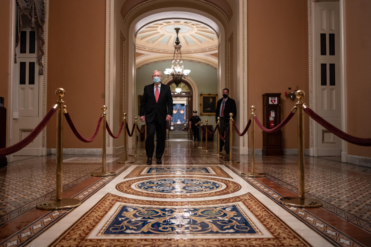 WASHINGTON, DC - DECEMBER 21: Senate Majority Leader Mitch McConnell (R-KY) walks to his office after leaving the Senate Floor at the U.S. Capitol on December 21, 2020 in Washington, DC. The House and Senate are set to vote today on a roughly $900 billion pandemic relief bill to bolster the U.S. economy amid the continued coronavirus pandemic that would be the second-biggest economic rescue measure in the nations history. (Photo by Cheriss May/Getty Images)