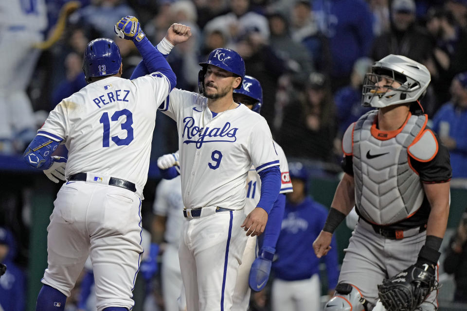 Kansas City Royals' Salvador Perez (13) celebrates with Vinnie Pasquantino (9) after hitting a three-run home run during the sixth inning of a baseball game against the Baltimore Orioles Saturday, April 20, 2024, in Kansas City, Mo. (AP Photo/Charlie Riedel)