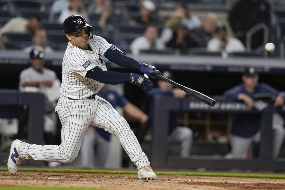 New York Yankees' Jose Trevino hits a single during the fourth inning of a baseball game against the Houston Astros, Tuesday, May 7, 2024, in New York. (AP Photo/Frank Franklin II)