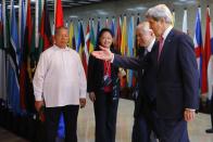 U.S. Secretary of State John Kerry (R) is greeted by Philippines' Foreign Secretary Albert del Rosario (2nd R) for a meeting in Manila December 17, 2013. (REUTERS/Brian Snyder)