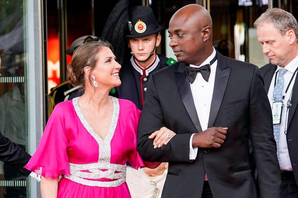 Princess Martha-Louise of Norway (L) and her fiancé self-professed shaman Durek Verrett (2nd R) arrive at the government's party celebratation of Norway's Princess' 18th birthday at Deichman Bjoervika, Oslo's main library, in Oslo, Norway, on June 16, 2022, months after her actual birthday.