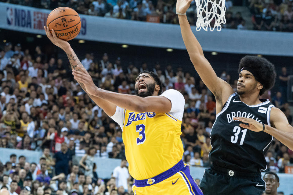 Anthony Davis left Saturday's preseason game against the Nets in China with a sprained thumb. (Getty Images)