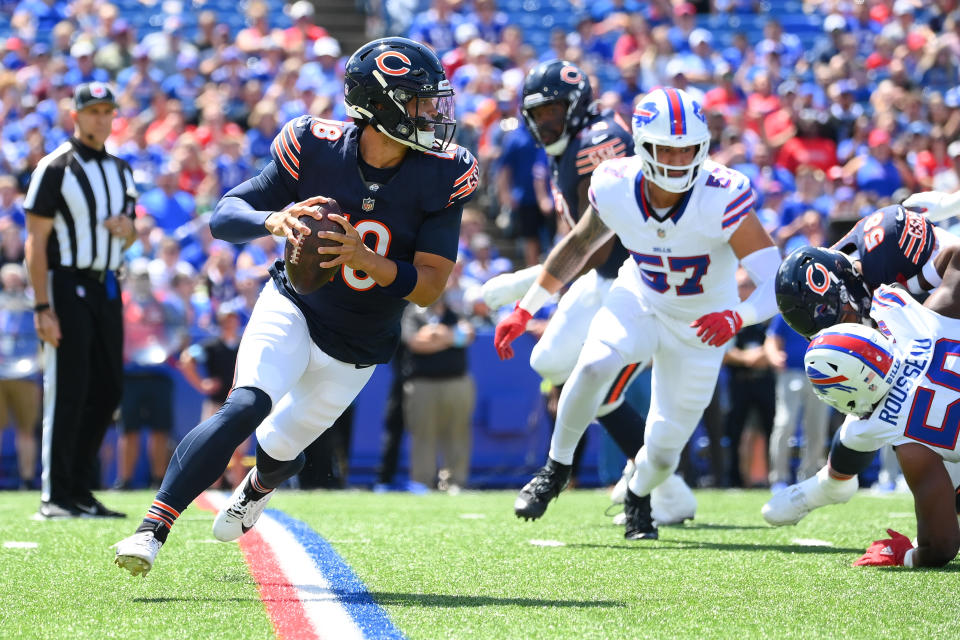 Caleb Williams, the No. 1 overall pick, runs out of the pocket against the Bills. (Rich Barnes/Getty Images)