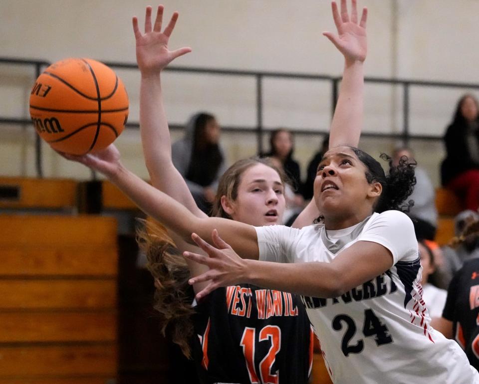 Pawtucket's Armani Rivera drives the lane past West Warwick defender Elizabeth Gresian in the second half of Thursday night's game.