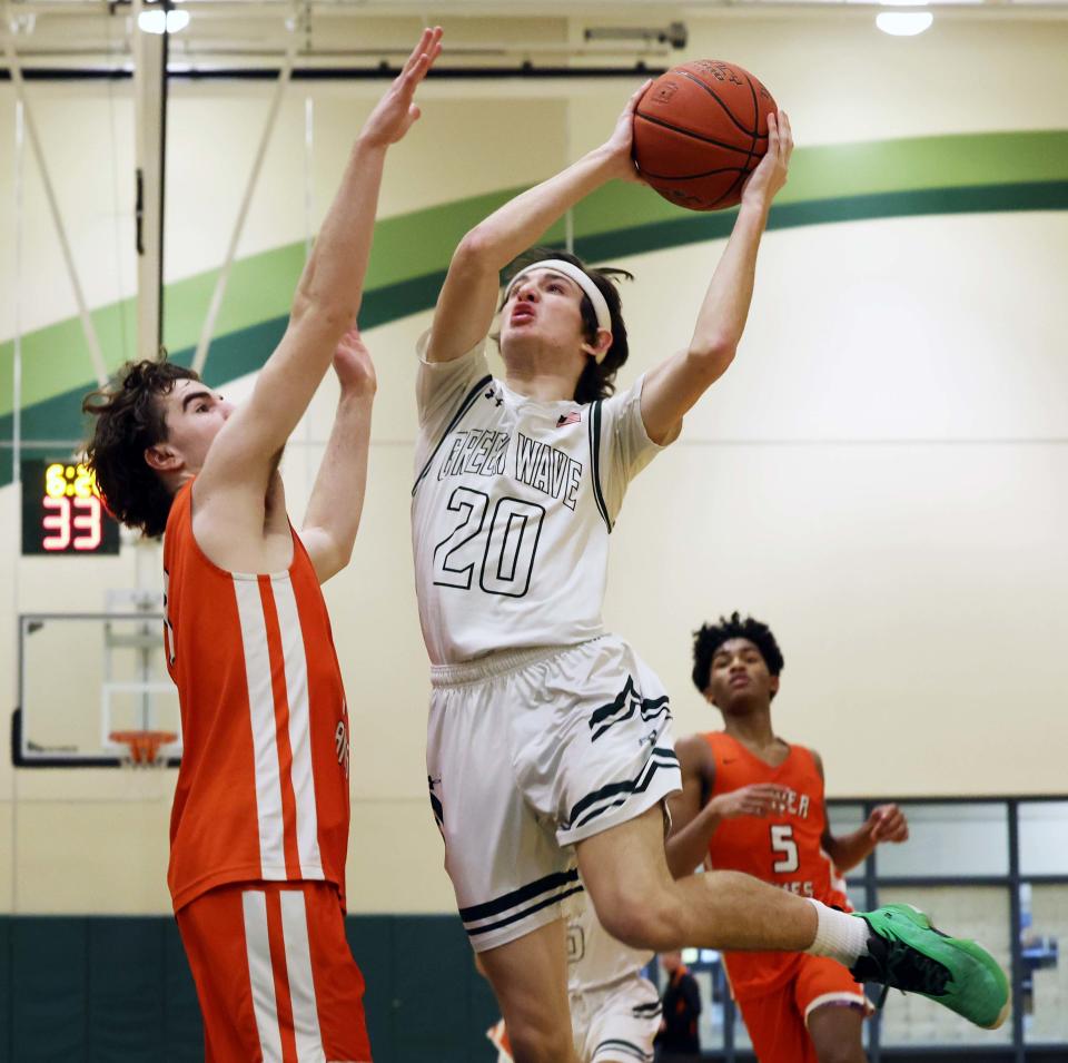Abington's Tyler Staiti takes a shot at the basket next to Oliver Ames Cole Craffey during the Don Byron memorial game on Wednesday, Feb. 15, 2023.