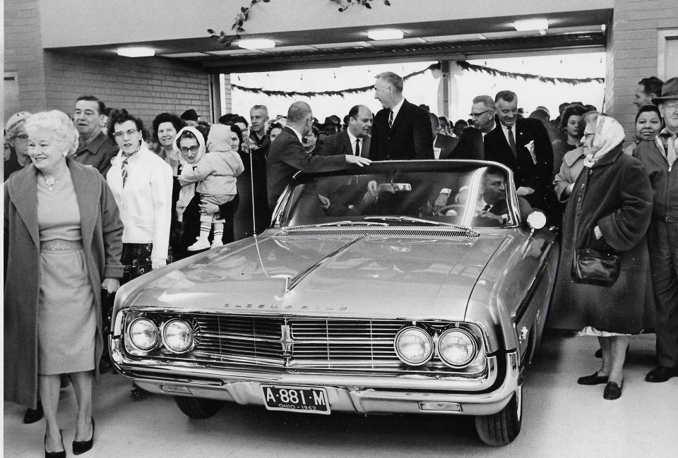 Akron Mayor Edward O. Erickson attends the 1962 ribbon-cutting ceremony at Five Points Shopping Center, riding on the back of an open convertible through a 16-foot “air curtain.” Look at all those eager shoppers.