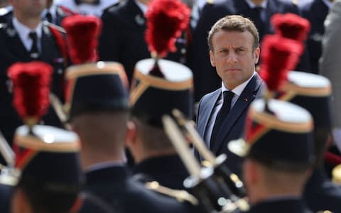 Emmanuel Macron reviews troops in June 2019  - Credit: LUDOVIC MARIN/AFP/Getty Images