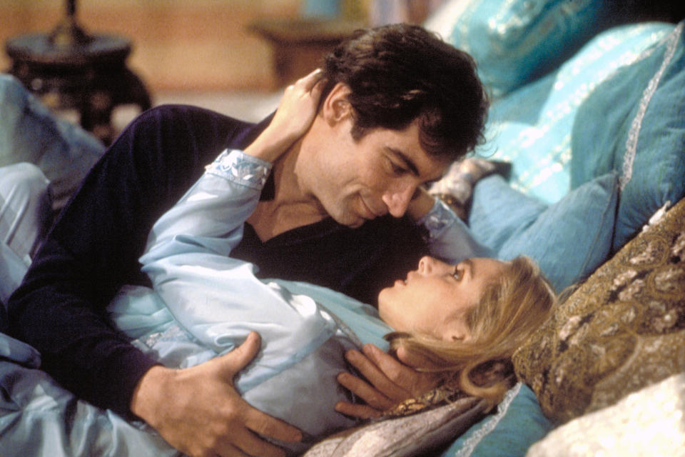 Actor Timothy Dalton and actress Maryam d'Abo on the set of 