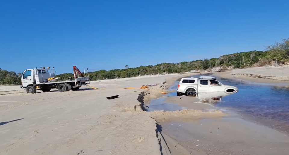 A utility being rescued from lagoon water on Bribie Island. 