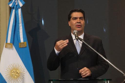 El jefe de Gabinete, Jorge Capitanich, en una rueda de prensa en Casa Rosada, el 7 de febrero de 2014 en Buenos Aires (PRENSA JEFATURA DE GABINETE/AFP | RICARDO CEPPI)