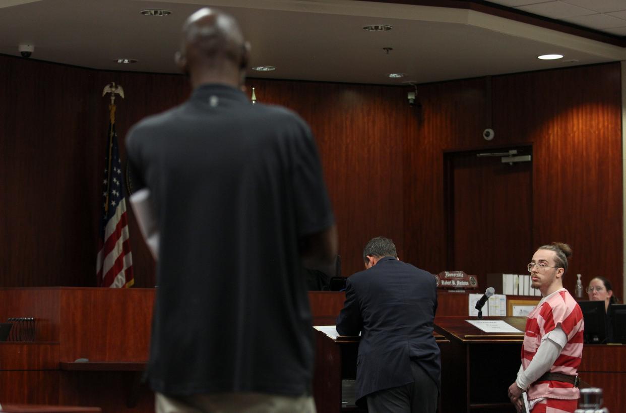 Camden Stukins, 22, looks back at Carlton Jones, father of Carltravius Jones during a victim statement before Judge Robert Meadows for sentencing, Thursday, May 9, 2024, at the Indian River County Courthouse. Stukins was sentenced to life in prison for a 2020 fatal shooting of 20-year-old Carltravius Jones outside a BP Express Mart at 20th Avenue Southwest and Oslo Road in Indian River County. After a four-day trial, a jury convicted Stukins of second-degree murder and other charges related to the Jan. 19, 2020 murder of Carltravius Jones, who had driven to the BP Express Mart with four others to purchase marijuana from Stukins, according to court records and trial testimony.