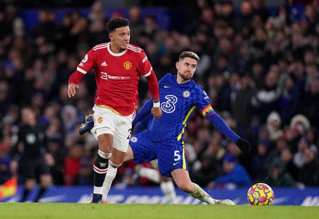 Jadon Sancho takes possession from Jorginho on his way to scoring