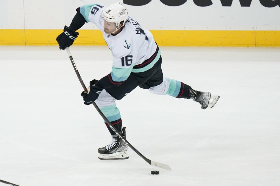 Seattle Kraken's Jared McCann (16) shoots during the third period of the team's NHL hockey game against the New Jersey Devils on Tuesday, Oct. 19, 2021, in Newark, N.J. The Devils won 4-2. (AP Photo/Frank Franklin II)