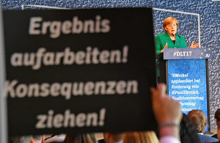 German Chancellor Angela Merkel addresses a meeting of her conservative CDU's youth organization, the Junge Union (Young Union), in Dresden, Germany, October 7, 2017. REUTERS/Matthias Rietschel