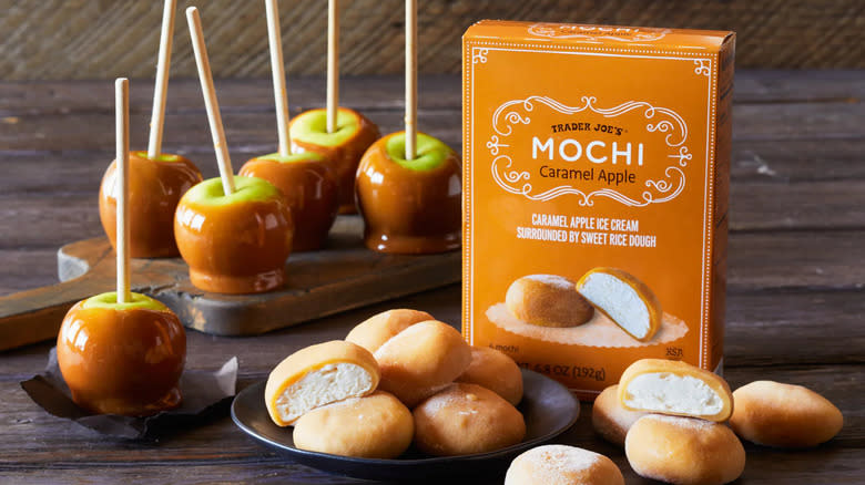 A box of Trader Joe's caramel apple mochi and a bunch of caramel apples