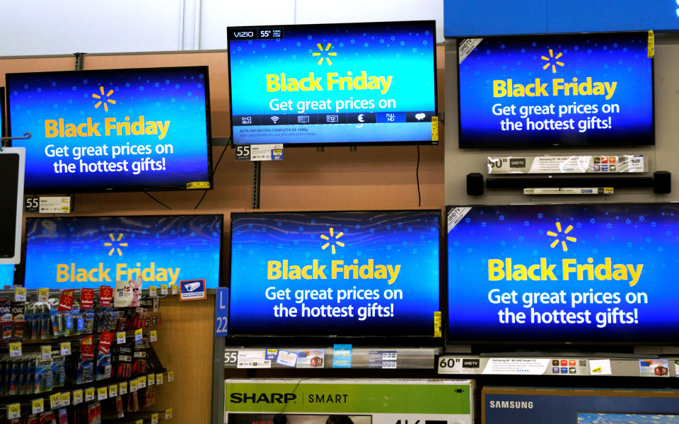 Advertisements of the upcoming Black Friday sales are seen on TV screens at a Walmart store in Westminster, Colorado, U.S. November 23, 2016. REUTERS/Rick Wilking