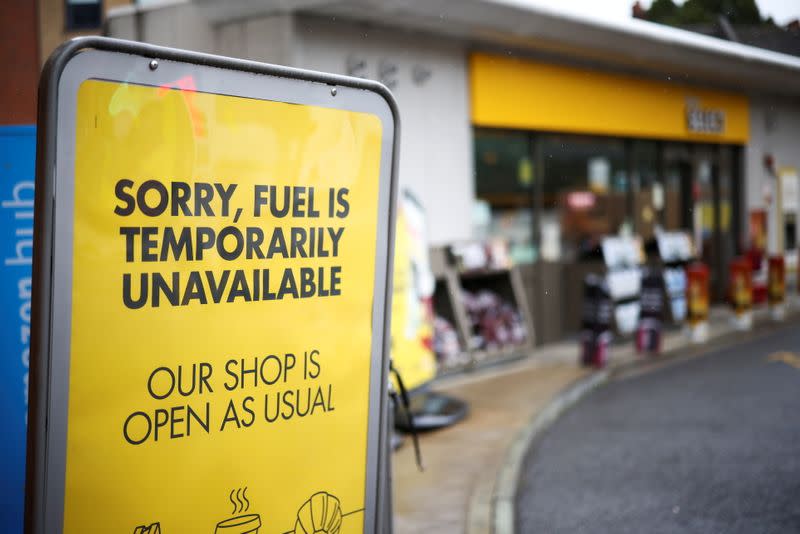 FILE PHOTO: A sign informing customers that fuel has run out is pictured at a Shell fuel station in London