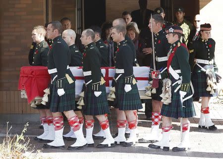 Pallbearers from Argyll and Sutherland Highlanders of Canada regiment carry the casket of Cpl. Nathan Cirillo from a funeral home in Ottawa October 24, 2014. REUTERS/Chris Wattie