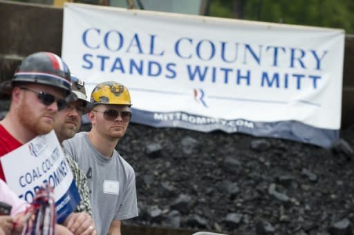 Coal miners listen as US Republican presidential candidate Mitt Romney speaks during a campaign event at the American Energy Corporation in Beallsville, Ohio. Romney says he is opposed to "all the sources of energy that come from above the ground"
