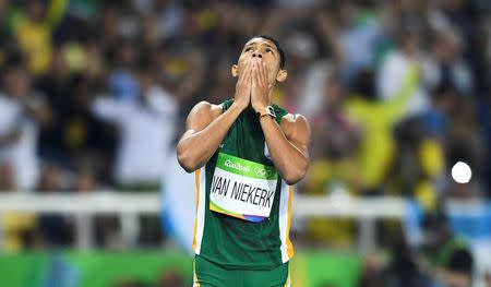 2016 Rio Olympics - Athletics - Final - Men's 400m Final - Olympic Stadium - Rio de Janeiro, Brazil - 14/08/2016. Wayde van Niekerk (RSA) of South Africa reacts after winning the final. REUTERS/Dylan Martinez