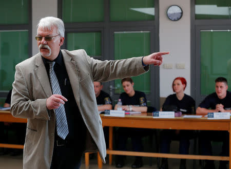 Attila Piros, police chief of Somogy county, teaches border hunter recruits during a training at the border crossing point in Barcs, Hungary March 8, 2017. REUTERS/Laszlo Balogh