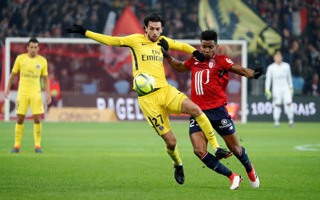 Soccer Football - Ligue 1 - LOSC Lille vs Paris St Germain - Stade Pierre-Mauroy, Lille, France - February 3, 2018 Lille’s Thiago Mendes in action with Paris Saint-Germain’s Javier Pastore REUTERS/Charles Platiau