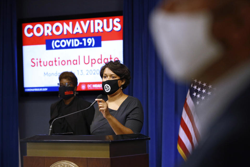 FILE - In this Monday, July 13, 2020 file photo, District of Columbia Mayor Muriel Bowser wears a face mask to protect against the spread of the coronavirus outbreak, as she speaks at a news conference on the coronavirus and the District's response in Washington. On Friday, Sept. 4, 2020, The Associated Press reported on stories circulating online incorrectly asserting Bowser proposed using her power to remove the Washington Monument and Lincoln Memorial in the wake of George Floyd’s death. The D.C. mayor did not call for the removal of the Washington Monument or Lincoln Memorial. The monuments are on federal land outside the mayor’s jurisdiction. (AP Photo/Patrick Semansky)