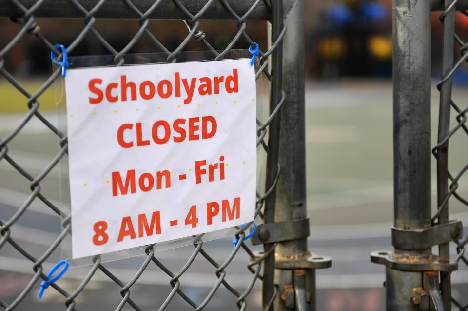 A schoolyard is closed outside a public school in the Brooklyn borough of New York City on November 19, 2020. - US coronavirus deaths passed a quarter of a million people on November 18 as New York announced it would close schools to battle a rise in infections. (Photo by Angela Weiss / AFP) (Photo by ANGELA WEISS/AFP via Getty Images)