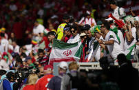 Iran's fans ahead of the World Cup group B soccer match between Wales and Iran, at the Ahmad Bin Ali Stadium in Al Rayyan, Qatar, Friday, Nov. 25, 2022. (AP Photo/Pavel Golovkin)