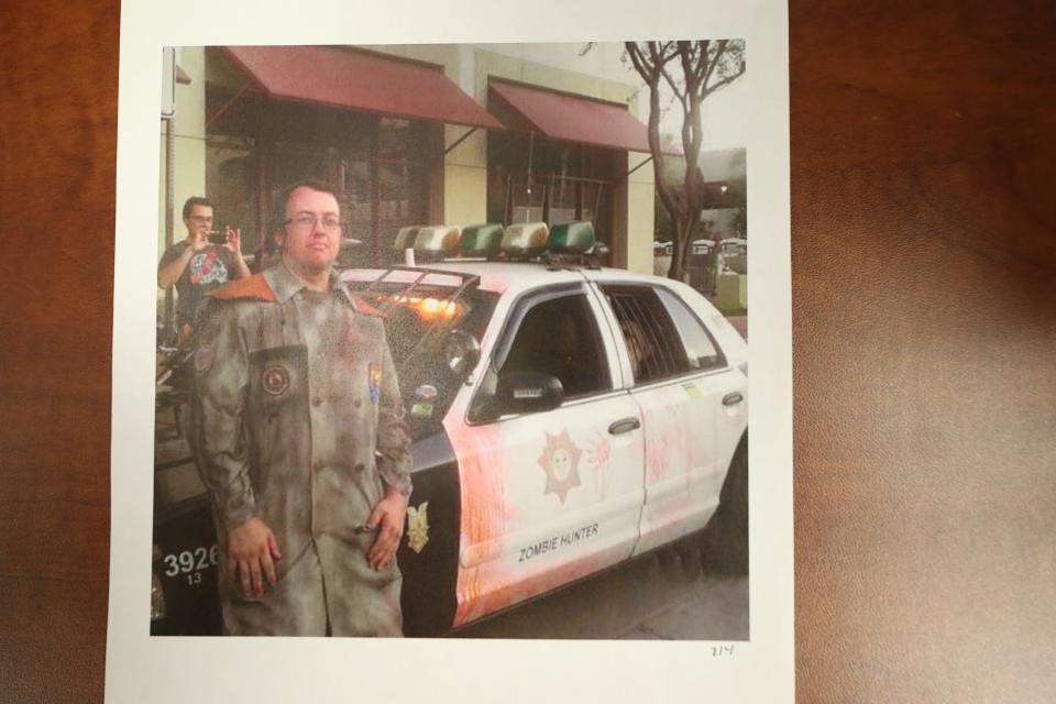 This exhibit from the "canal murders" trial shows Bryan Patrick Miller posing with his "Zombie Hunter" car.