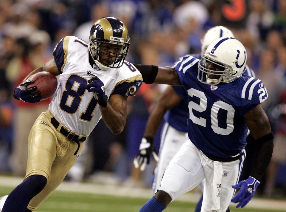 St. Louis Rams receiver Torry Holt breaks the tackle of Colts defender Mike Doss to gain 36 yards on a first-quarter pass from quarterback Mark Bulger in Indianapolis, Monday, Oct. 17, 2005.