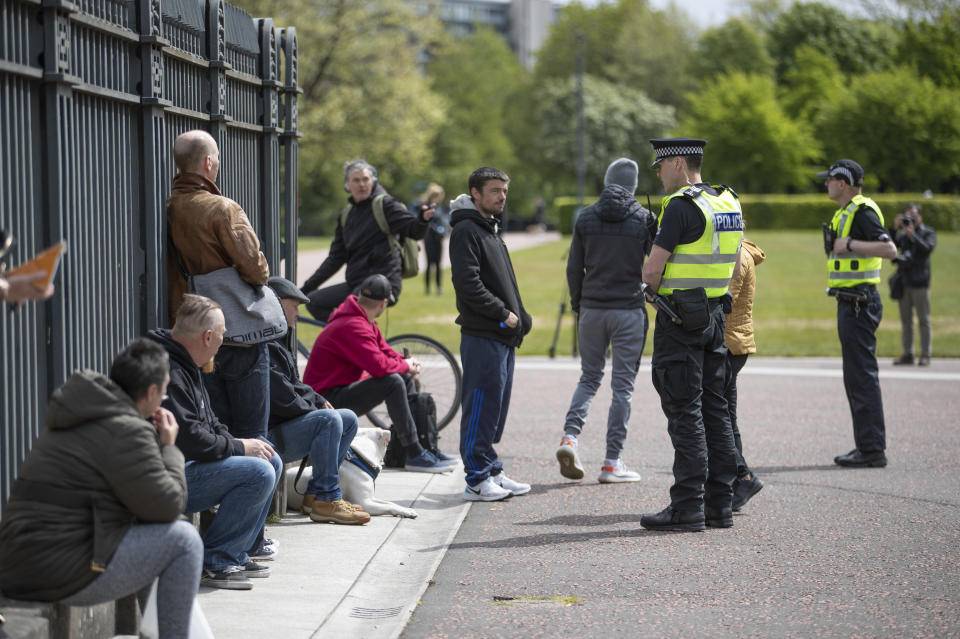 Police patrol Glasgow Green where members of the public gathered, as part of gatherings taking place this weekend across the UK against the coronavirus pandemic restrictions after the introduction of measures to bring the country out of lockdown.