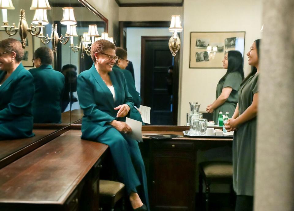 Karen Bass chats with her daughter Yvette Lechuga before making her victory speech at the Wilshire Ebell Theatre