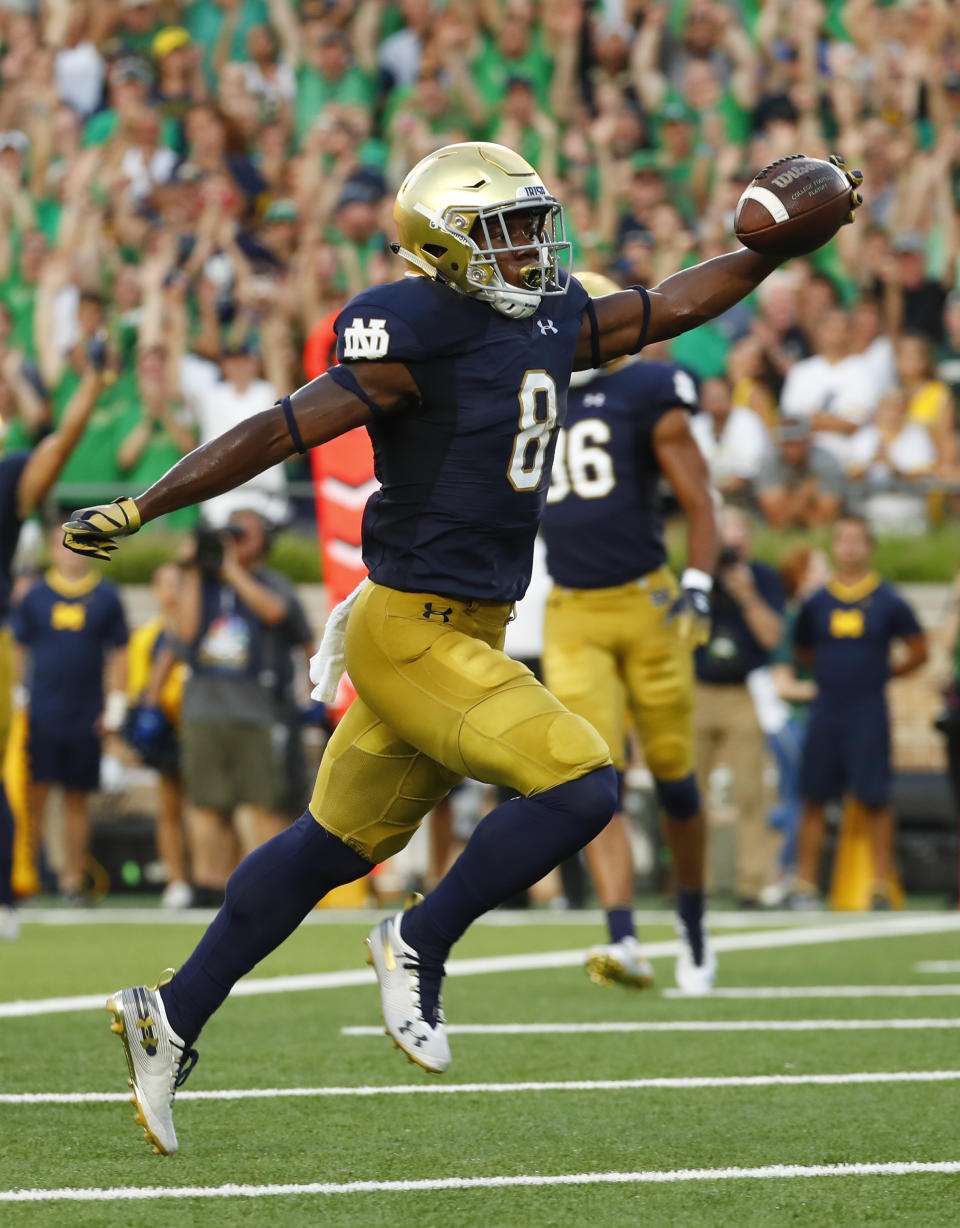 Notre Dame wide receiver Jafar Armstrong (8) celebrates as he scores a touchdown against Michigan in the first half of an NCAA football game in South Bend, Ind., Saturday, Sept. 1, 2018. (AP Photo/Paul Sancya)