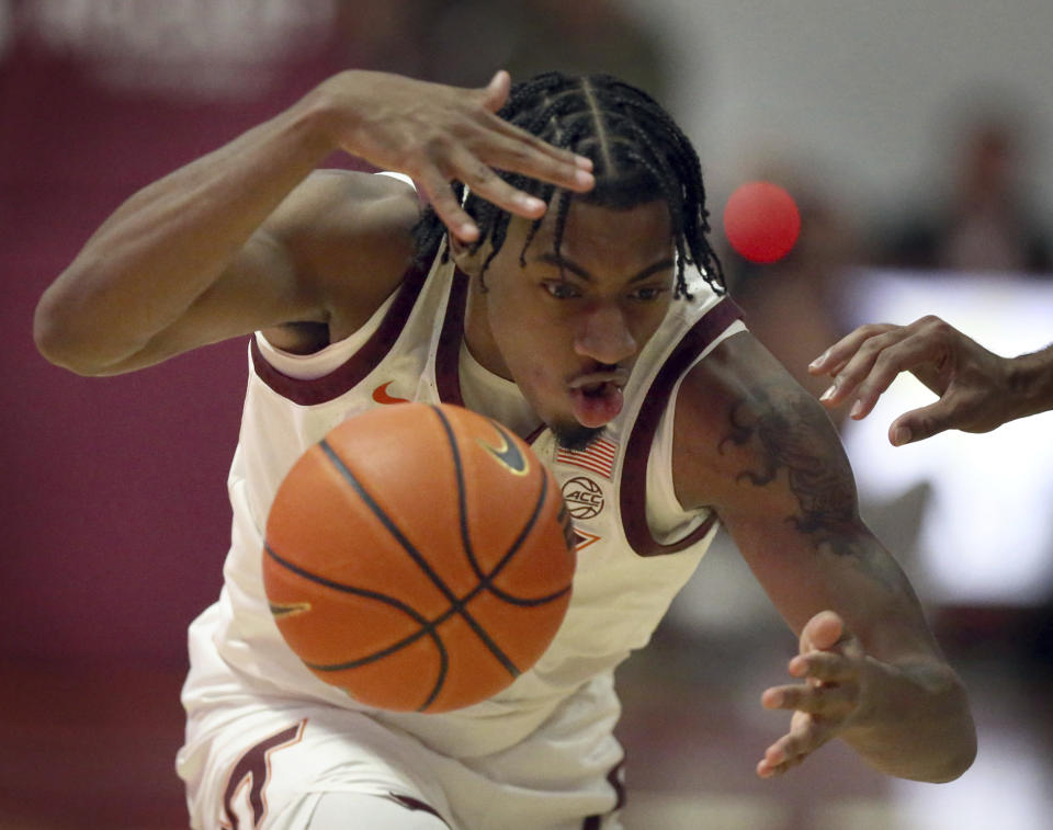 Virginia Tech's MJ Collins (2) loses control of the ball for a turnover to Florida State during the first half of an NCAA college basketball game Tuesday, Feb. 13, 2024, in Blacksburg, Va. (Matt Gentry/The Roanoke Times via AP)