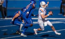 Boise State quarterback Jack Sears tries to evade nose tackle Scale Igiehon but the Bronco defense is credited with a sack during the 2021 Spring Game Saturday, April 10, 2021, at Albertsons Stadium in Boise.