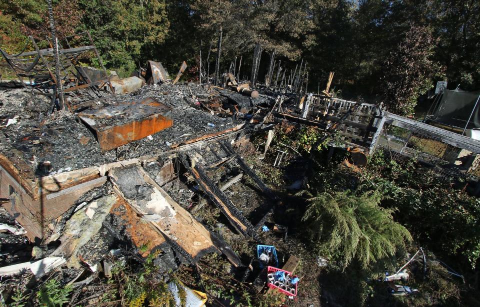 The remains of a home on Brentwood Lane near Stanley Monday morning, Oct. 23, 2023.