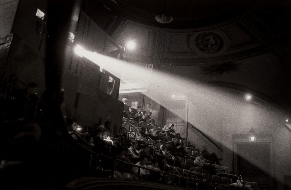 Diane Arbus’ “42nd street movie theater audience, N.Y.C.,” 1958. “The light from the projection booth streams through the dark cavernous room and brings with it the joy and wonder of film,” says Christie’s Darius Himes of the image. - Credit: CHRISTIE'S IMAGES LTD. 2022