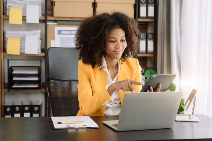 A woman reviewing how much money she saved after using a tax-saving strategy.