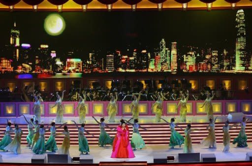 Chinese singer Peng Liyuan performs at the Grand Variety Show in Hong Kong, in 2007. Peng is a dazzling singer whose profile long eclipsed that of her husband Xi Jinping, and who will bring a touch of glamour to a role hidden in the shadows for decades