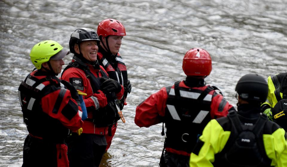 The Massillon, Jackson Township and Wooster Township fire departments took part in a water rescue course via Dive Rescue International. Jerry Richert, left, of Indianapolis, instructs firefighters along the Tuscarawas River in Massillon.