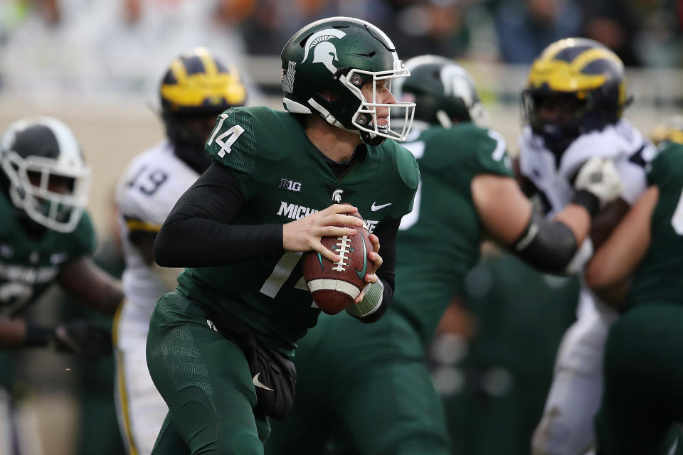 Brian Lewerke #14 of the Michigan State Spartans looks to pass during the second half while playing the Michigan Wolverines at Spartan Stadium on Oct. 20, 2018 in East Lansing, Michigan. Gregory Shamus/Getty Images