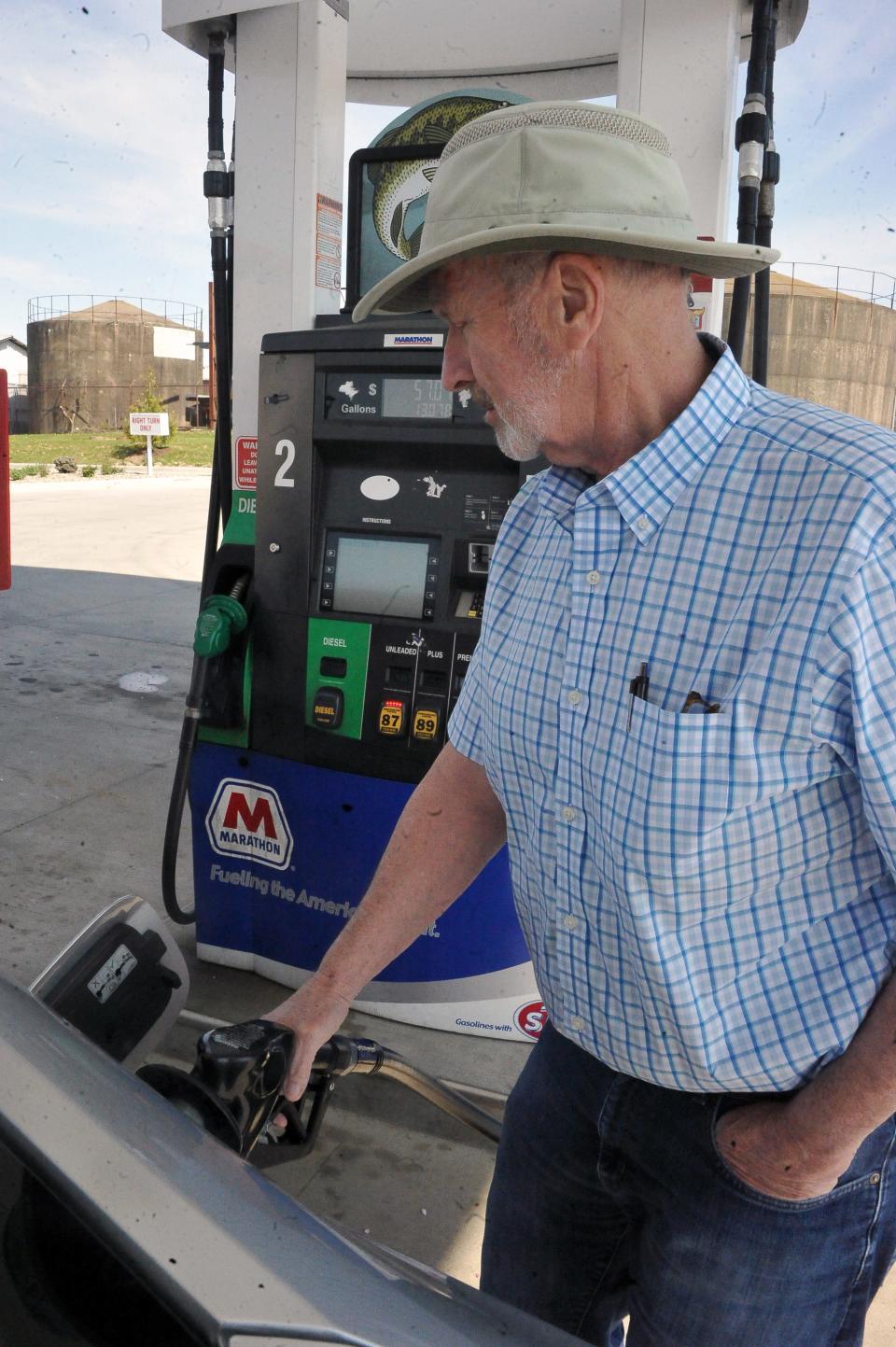 Jon Everett pumps gas at $4.35 gallon in Wayne County.