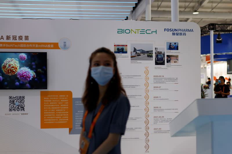 FILE PHOTO: The BioNTech logo is seen at the booth of Fosun Pharmaceutical (Group) in Beijing