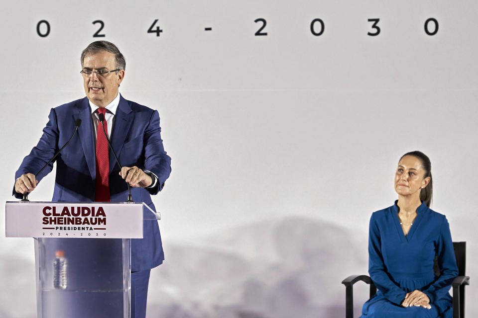 MEXICO CITY, MEXICO - JUNE 20: Marcelo Ebrard speaks as President-elect of Mexico Claudia Sheinbaum looks at him during the announcement of the new Government Cabinet at MIDE- Museo Interactivo de Economía on June 20, 2024 in Mexico City, Mexico. Sheinbaum confirmed Ebrard as the Secretary of Economy. (Photo by Jaime Nogales/Medios y Media/Getty Images)