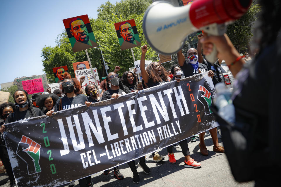 Protesters chant as they march after a Juneteenth rally at the Brooklyn Museum Friday. (Photo: ASSOCIATED PRESS)