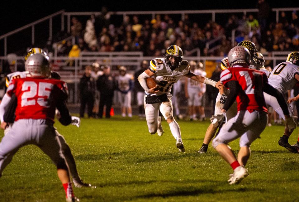 Colonel Crawford's Connor McMichael breaks through the Buckeye Central defense for a touchdown.