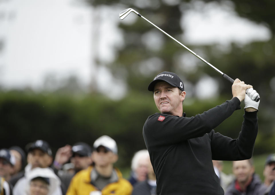 Jimmy Walker follows his shot from the fourth tee during the final round of the AT&T Pebble Beach Pro-Am golf tournament, Sunday, Feb. 9, 2014, in Pebble Beach, Calif. (AP Photo/Eric Risberg)